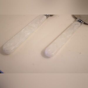 Knife and cake lift, stamped metal. Elegant White Handle Utensils